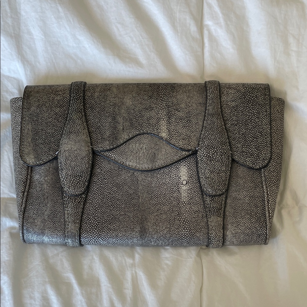 BCBGMaxAzria, Gray Stylish Textured Clutch. Magnetic closure.